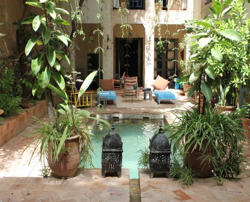 The calm courtyard pool waiting at Dar Louisa